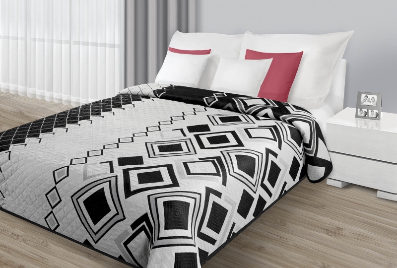 Modne narzuty dwustronne na łóżko do sypialni w kolorze szarym z czarnym wzorem