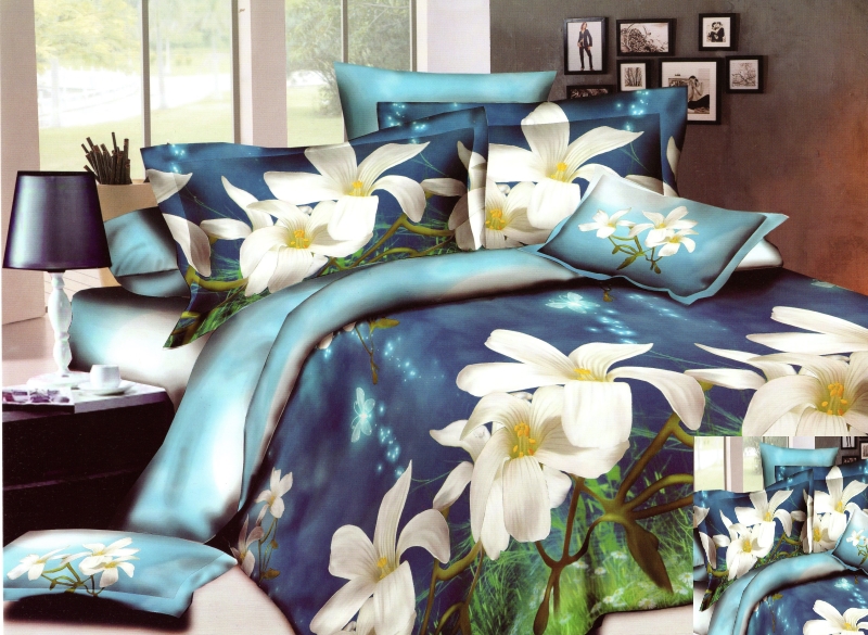 Niebieska pościel do sypialni w białe kwiaty