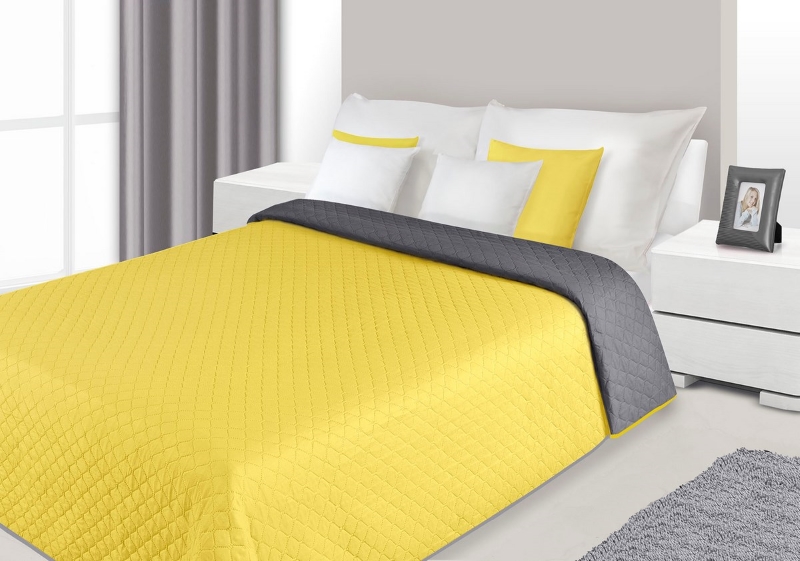Modne narzuty dwustronne na łóżko w kolorze żółto stalowym do sypialni